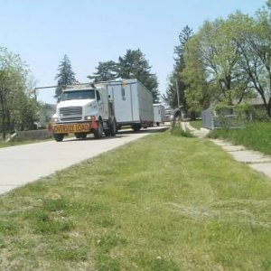 Two-Story in Waucoma, delivery trucks